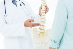 Doctor and spine degenerative disc disease