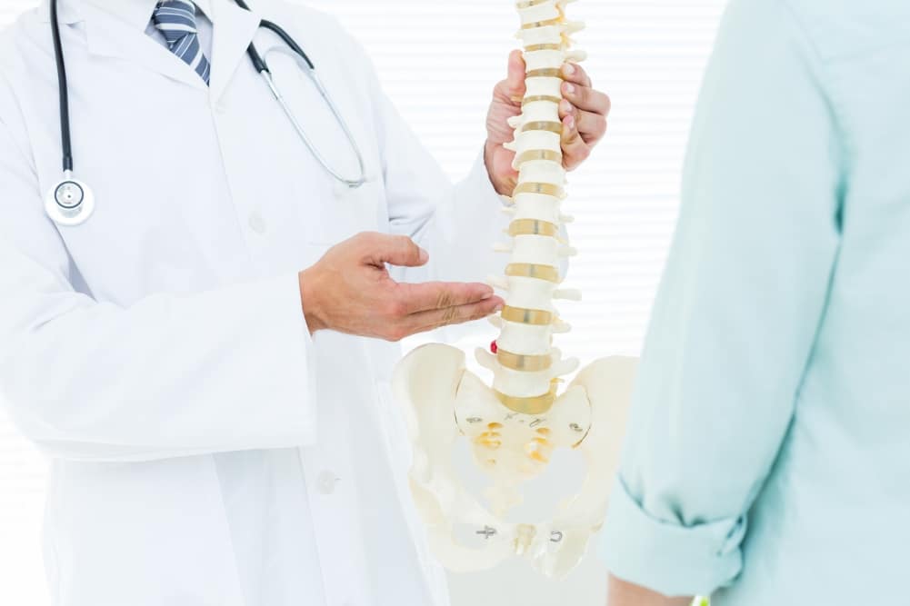 Doctor and spine degenerative disc disease