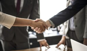 Resourcing business handshake - Newcastle Research Institute - Genesis Research Services